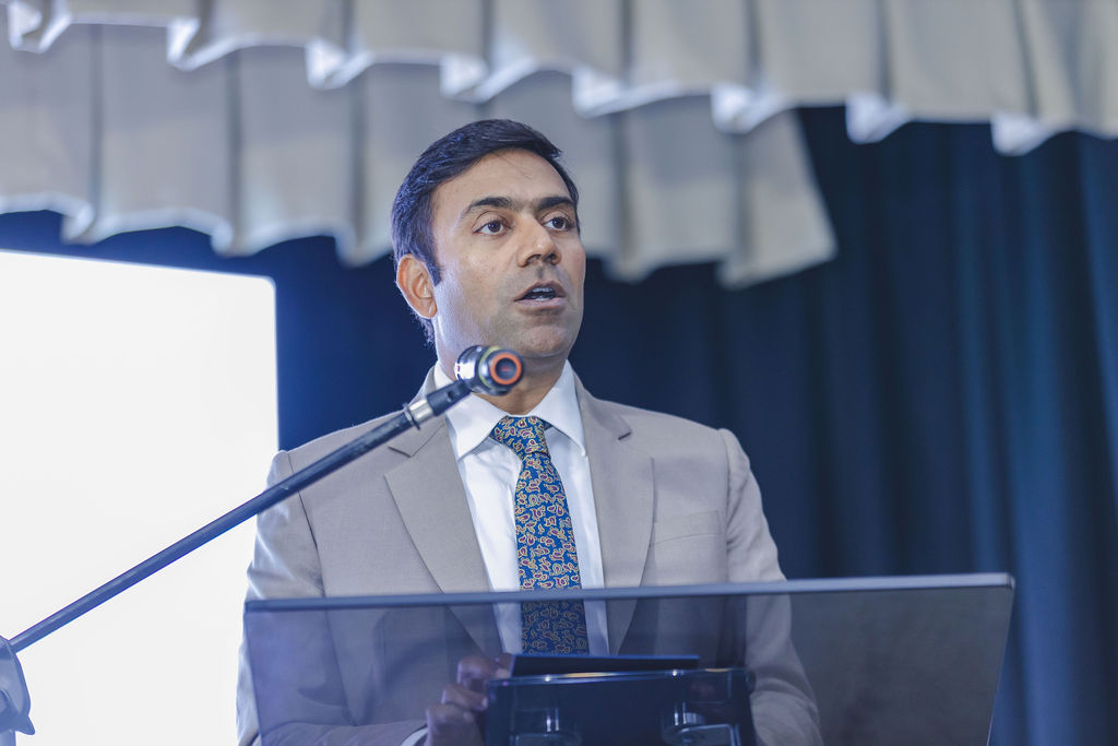 Speaker delivering an Investment Summit presentation
