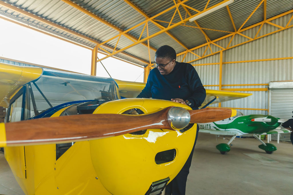 Summit participant viewing a light aircraft at Gariep Dam