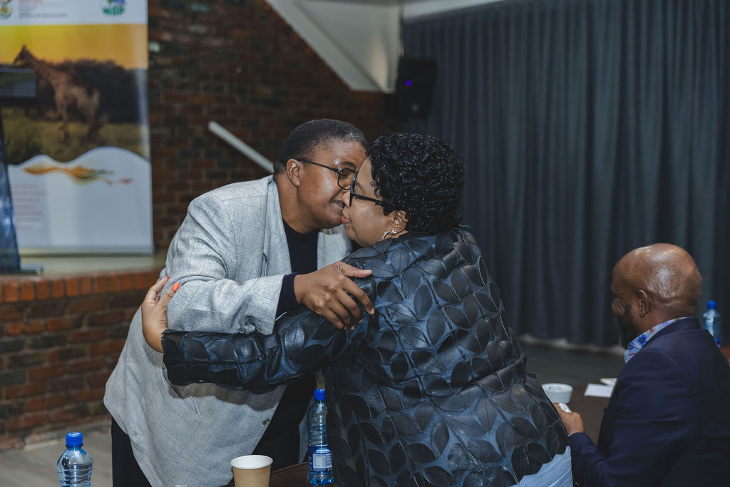 Summit delegates greeting one another during the programme