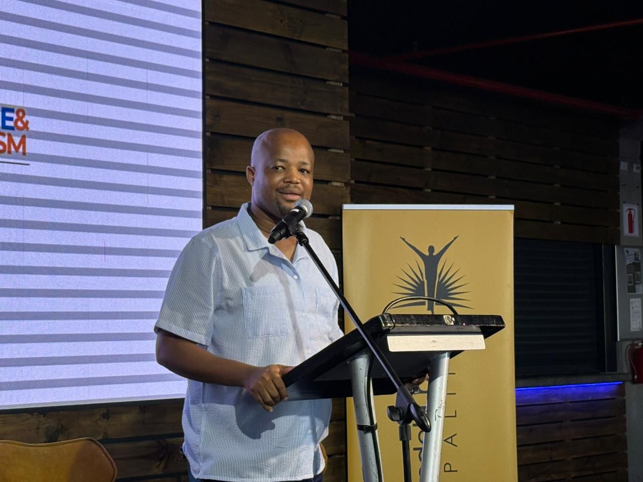 Speaker addressing delegates at the Trade Market