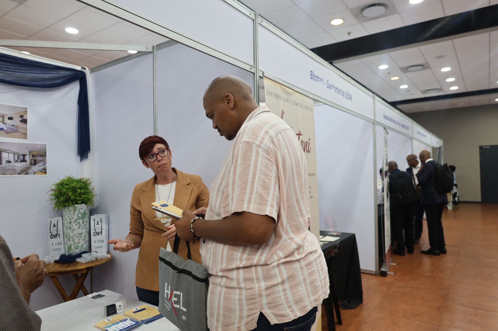 Delegate engaging with an exhibitor